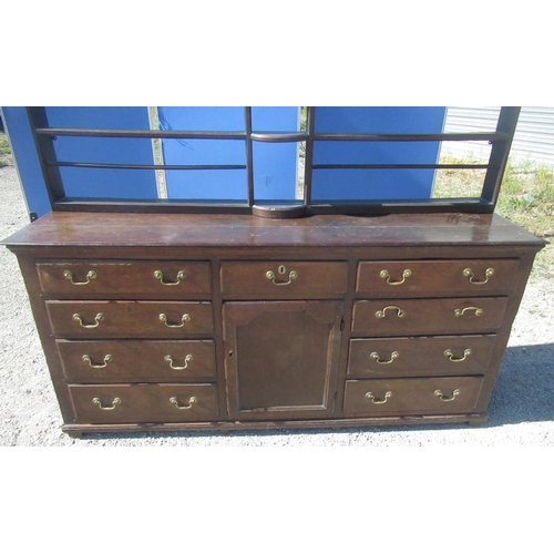 1321 - Geo.III oak dresser, three tier back with dentil cornice, moulded planked top and nine drawers with ... 