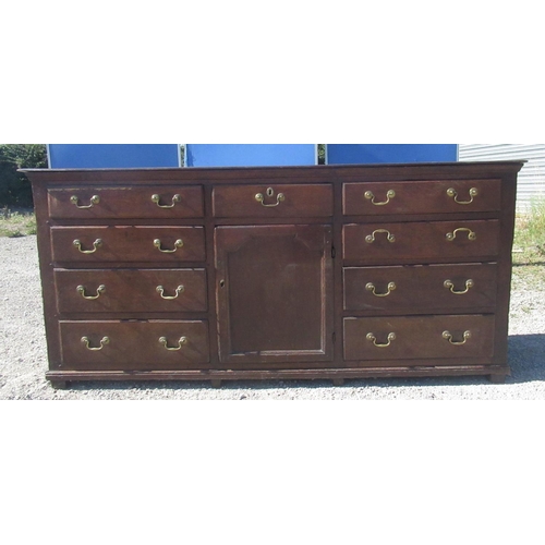 1321 - Geo.III oak dresser, three tier back with dentil cornice, moulded planked top and nine drawers with ... 