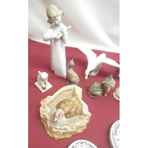 265 - Lladro figure of a girl with a banjo, Lladro swan and two cats, 2 Royal Doulton kittens, 2 Franklin ... 