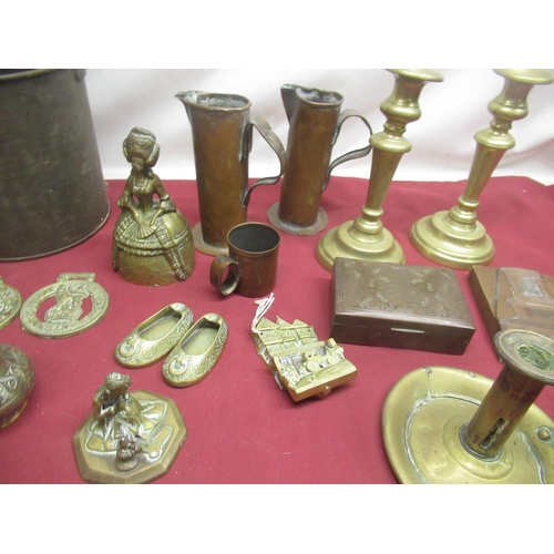 272 - Metal fruit press, two brass candlesticks, brass chamberstick, Arnold and Sons copper Dariol mould w... 