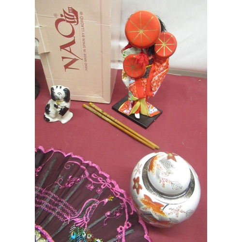 290 - Nao figure of a lady with a flower with original box, Geisha doll, 2 African tribal art heads from N... 