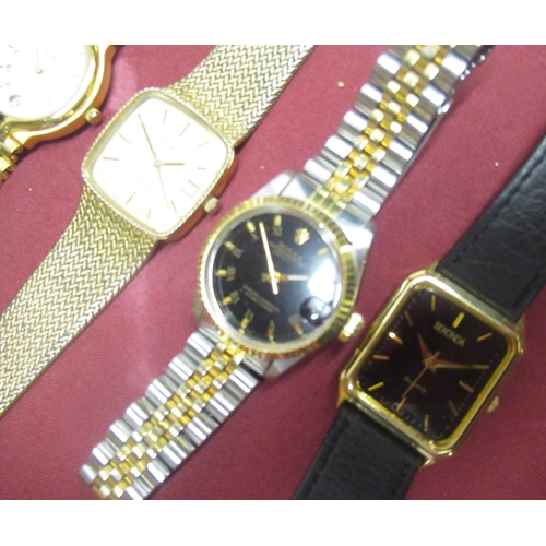 143 - Late 1970's rotary quartz wristwatch with date, gold plated case on integrated bark effect bracelet,... 