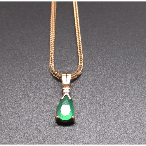 1 - 18ct yellow gold pendant set with pear cut emerald and brilliant cut diamond, on 18ct yellow gold sn... 