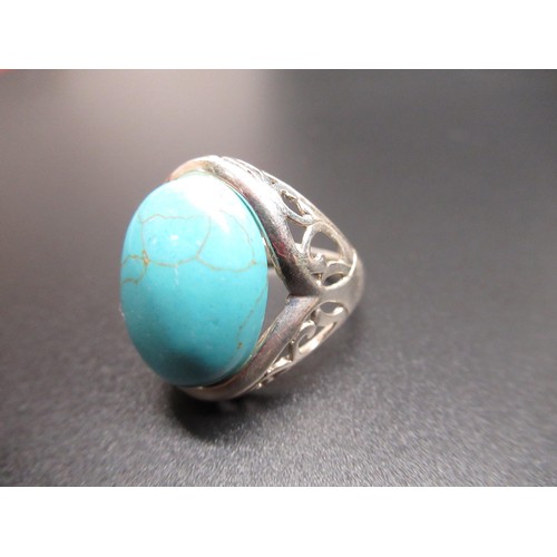 40 - Sterling silver ring set with cabochon turquoise, size P, stamped 925, and a Sterling silver circula... 