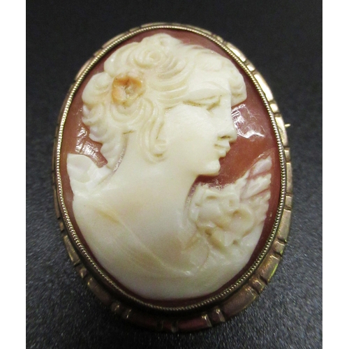 29 - C20th shell cameo brooch of a young woman in profile on 9ct yellow gold mount, and another smaller s... 