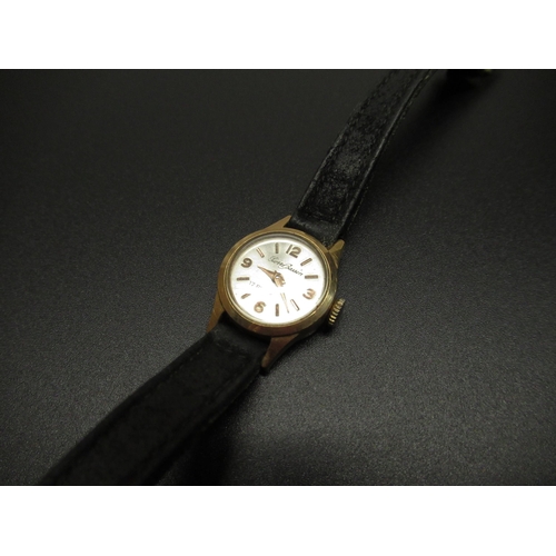 70 - Ladies Pierre Bassin 18ct gold hand wound wrist watch, signed silvered dial with applied gold colour... 