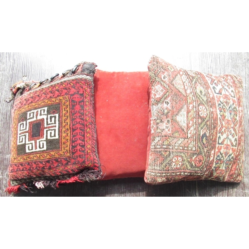 1040 - Three Eastern carpet cushions, 40cm x 40cm max (3)