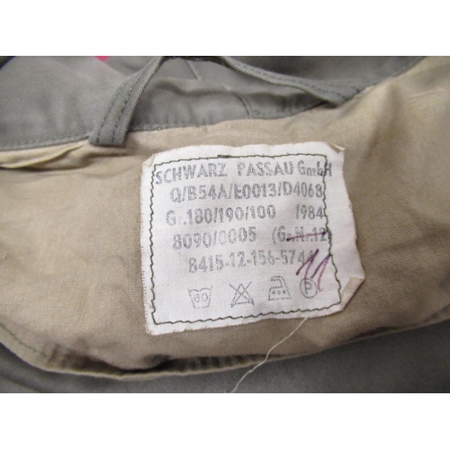 162 - German military type parka, label dated 1984, canvas kit bag, two military type cased binoculars (4)