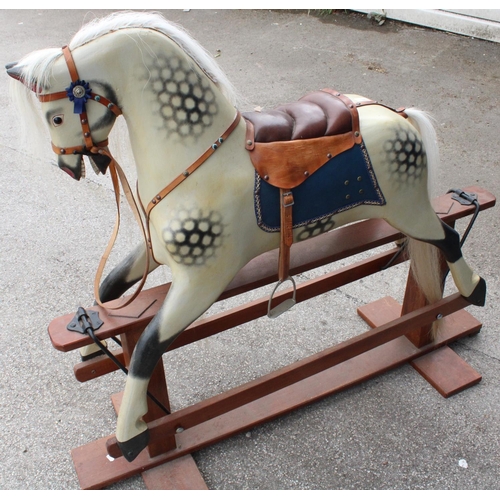 867 - C20th rocking horse in dapple cream coat with white hair plume and tail, leather saddle and stirrups... 