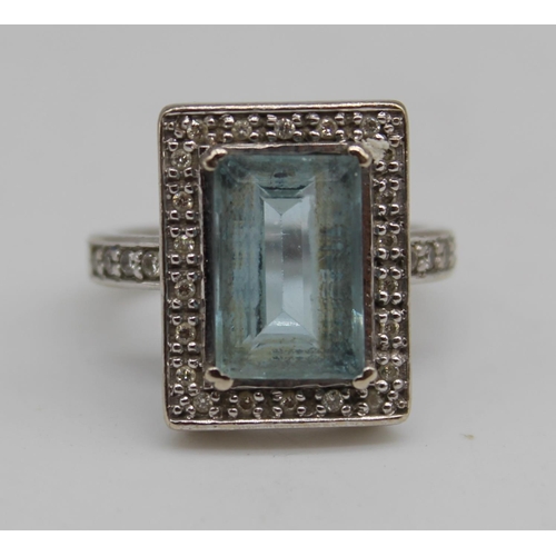 248 - 9ct white gold ring set with emerald cut aquamarine, surrounded by diamonds in millegrain setting, s... 