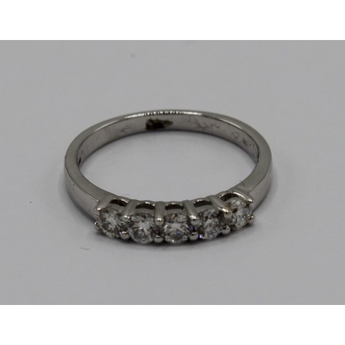 249 - 18ct white gold ring, set with five brilliant cut diamonds, stamped 750, size N, 3.2g