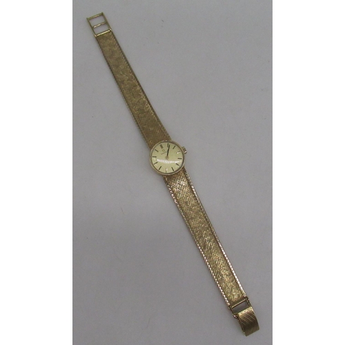 305 - Ladies Omega 9ct gold hand wound wristwatch, signed brushed gold dial with applied baton markers, tw... 