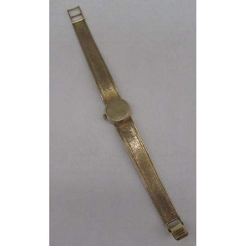 305 - Ladies Omega 9ct gold hand wound wristwatch, signed brushed gold dial with applied baton markers, tw... 