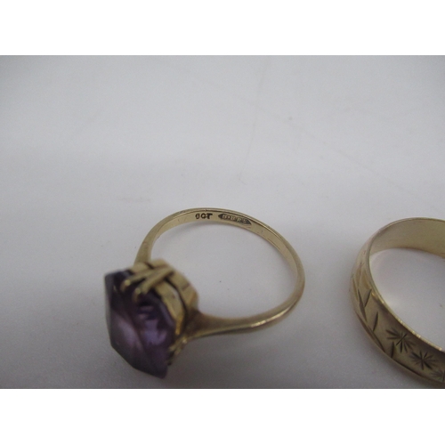 36 - 9ct yellow gold ring set with a purple stone, stamped 9ct size, 9ct yellow gold wedding band with fl... 