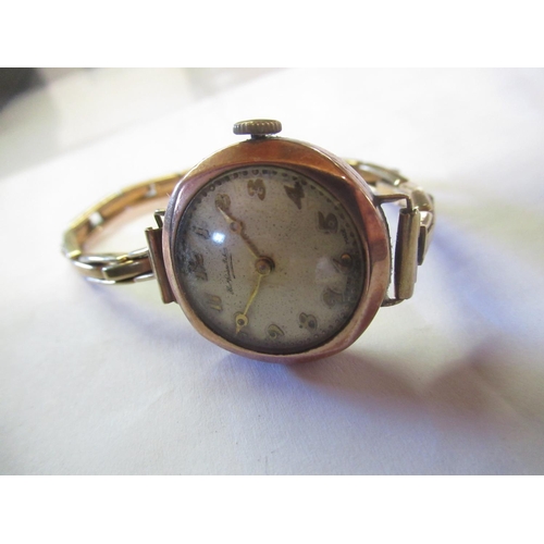 90 - Retailed by Thomas Russell & Son C20th ladies 9ct rose gold cased hand wound wristwatch, signed silv... 