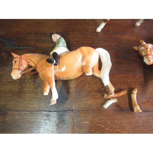 752 - Three Beswick models, including two of boy on pony, in palomino colourway, model nos. 1500, one seco... 