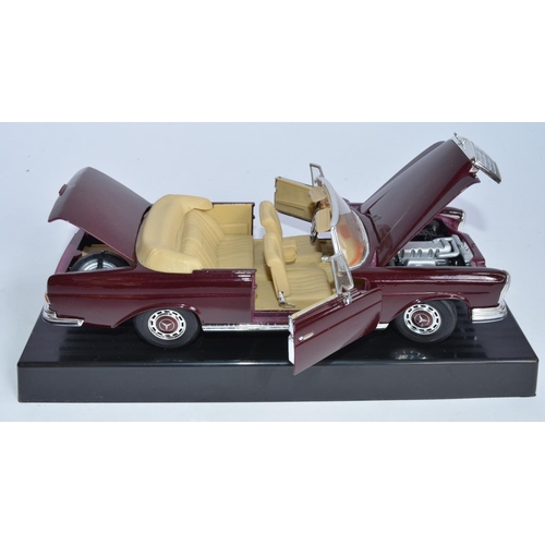 820 - 2 1/18 scale die-cast model cars:
Burago 1937 Jaguar SS100 (cat no 3006)-attached to base.
Maisto sp... 