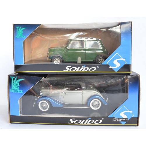 821 - 2 Solido 1/18 die-cast model cars, a Mini Cooper (no cat no, model as new, box fair missing polystyr... 