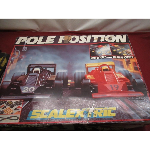 923 - Scalextric Pole Position circuit track and cars in original box together with similar Scalextric veh... 