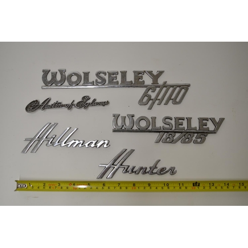 813A - Five vintage chromed car manufacturers signs including Wolsey 6/110, Hillman Hunter, Austin of Engla... 