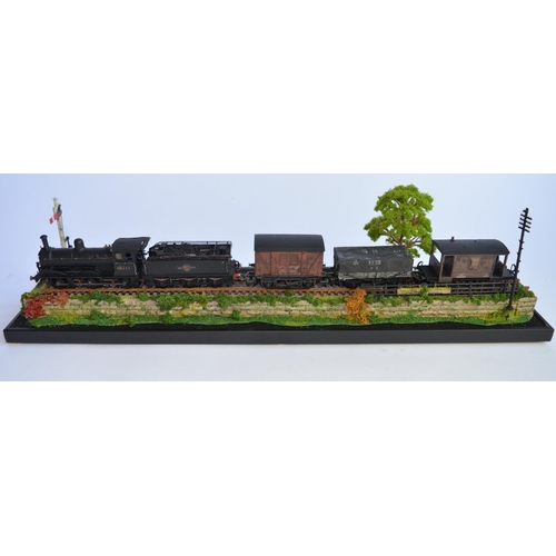 704 - An OO gauge diorama with lead framed glass display case. Loco unknown manufacturer but is a working ... 