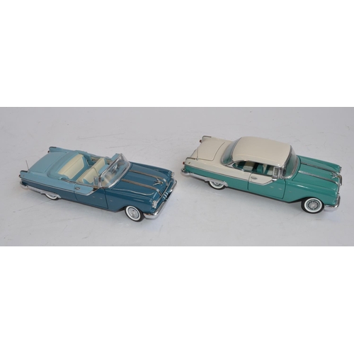 855 - 2 boxed 1/24 die-cast model cars by Franklin Mint, both in near mint condition:
1955 Pontiac Star Ch... 