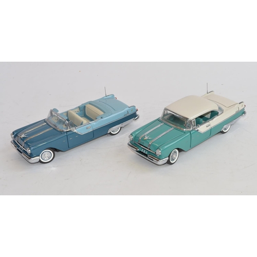 855 - 2 boxed 1/24 die-cast model cars by Franklin Mint, both in near mint condition:
1955 Pontiac Star Ch... 