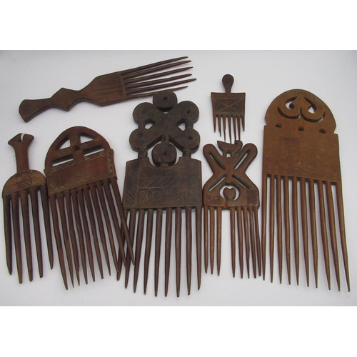 199 - Collection of seven various carved wood African native combs