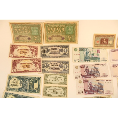 307 - A wad of world bank notes to include early C20th Dutch, German and Belgian, Japanese Government note... 