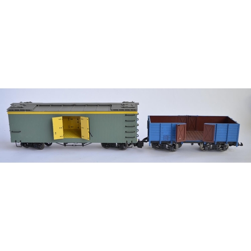 679 - 2 boxed G gauge twin bogie wagons, 1 an LGB open wagon, the other closed by Bachmann. Both re-painte... 