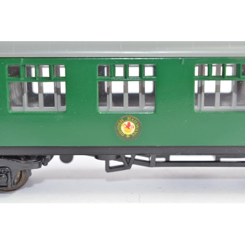 758 - 4 magazine syndicated OO gauge railway passenger coaches (no makers marks), models as new, and a sin... 