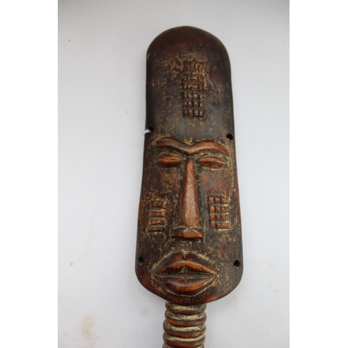 148 - Carved wooden African figure of female with neck rings and elongated head