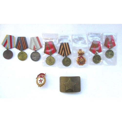 61 - Eight Russian medals, some stamped 1945 - 2005, another stamped 1945 - 1995, Russian cap badge and R... 