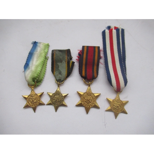 62 - Collection of four miniature Star medals - Atlantic Star, France Star, Germany Star, Burma Star and ... 