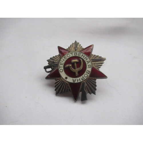 70 - Three Russian medallions, one of Bolshevik revolution, and Russian cap badge (4)