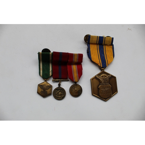 78 - Collection of four medals, medal of merit, mini medal of medal, national defence medal etc