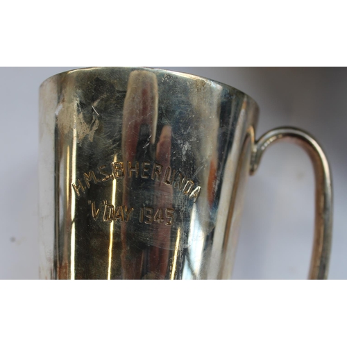 246 - A military hand held signal lamp and a silver plated tankard hms  bherlinda v day 1945