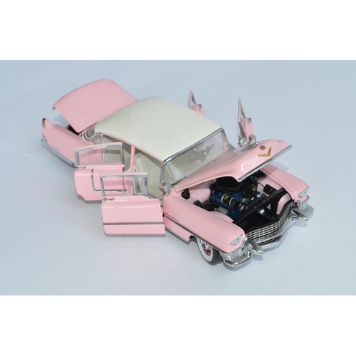 814A - A Franklin Mint 1/24 Elvis Presley 1955 Pink Cadillac diecast model car, with box, paperwork and all... 