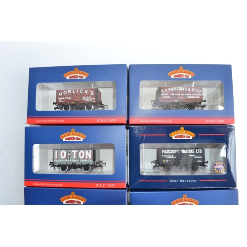 769 - 7 Bachmann (mostly Collectors Club exclusives) and 1 Hornby OO gauge plank wagons.