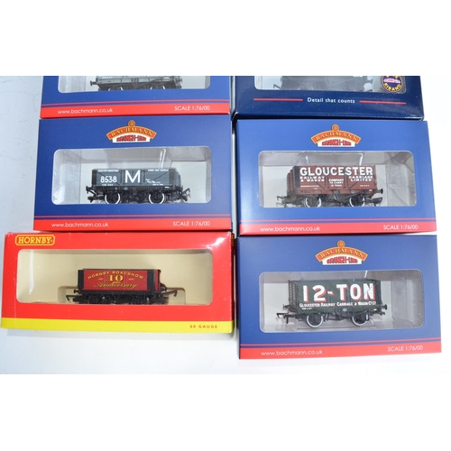 769 - 7 Bachmann (mostly Collectors Club exclusives) and 1 Hornby OO gauge plank wagons.