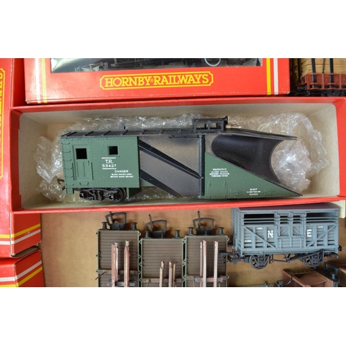 776 - A collection of used OO gauge rolling stock, wagons etc including a Tri-Ang snow plough and 3 boxed ... 