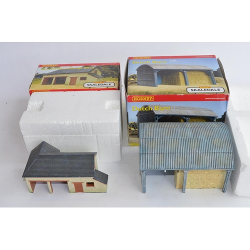 777 - A collection of OO gauge wagons, buildings (including 3 boxed ceramic Skaledale buildings, dirty but... 