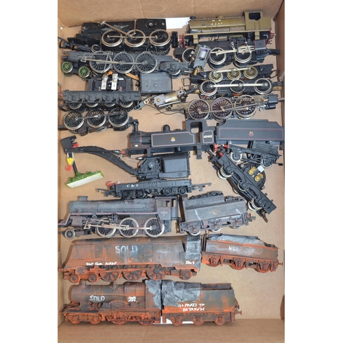 779 - A collection of OO gauge train parts, motors, spare wheels etc. Includes 2 heavily weathered static ... 