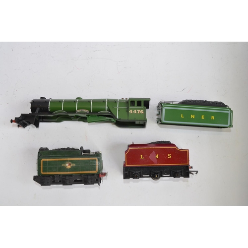 779 - A collection of OO gauge train parts, motors, spare wheels etc. Includes 2 heavily weathered static ... 