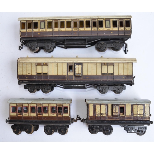 697 - 4 pre-war O gauge Bing and Carette railway coaches.