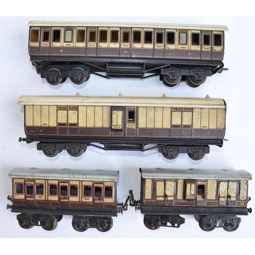 697 - 4 pre-war O gauge Bing and Carette railway coaches.