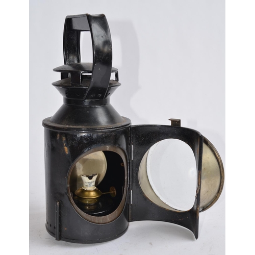 804 - A vintage LMS railway lamp with brass plate attached 'LMS 48770'. Height to handle top 29cm.