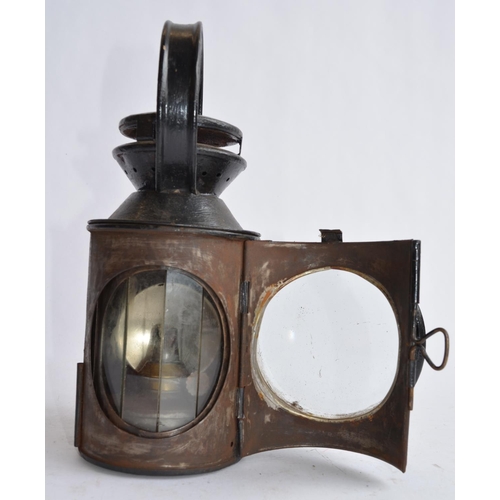 805 - An LMS Railways signal lamp, plate stamped 'R204'. Height to handle top 29cm.