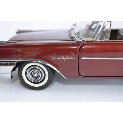 865 - 2 boxed Danbury Mint 1/24 diecast car models:
1958 Chrysler 300D Sport Coupe, good condition, some r... 