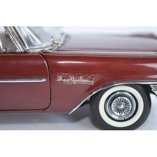 865 - 2 boxed Danbury Mint 1/24 diecast car models:
1958 Chrysler 300D Sport Coupe, good condition, some r... 